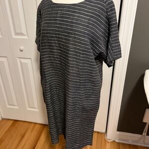 Eileen Fisher. Size Small but I wear 10 and this is roomy on me. Like new.